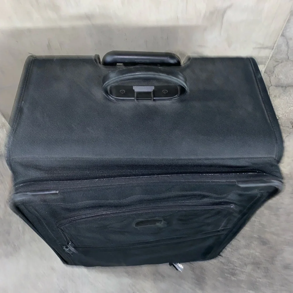 TUMI Check On Suitcase